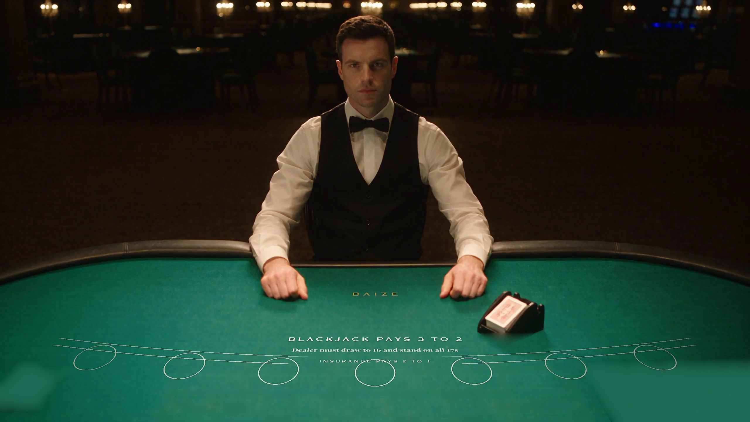 Simulated blackjack dealer at a green-felt table